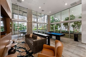 Game room space at g12 apartments in los angeles, ca 90015